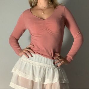 Pink ballerina-style long sleeve top
